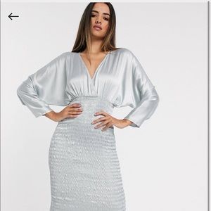 ASOS DESIGN SHIRRED SATIN MIDI DRESS WITH BATWIG SLEEVE IN LIGHT BLUE.